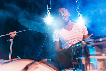 Image showing Young african-american jazz musician playing drums