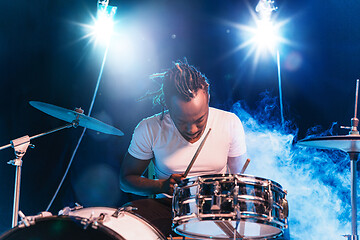 Image showing Young african-american jazz musician playing drums