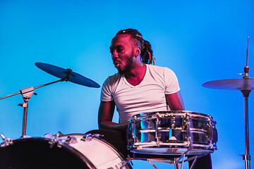 Image showing Young african-american jazz musician playing drums