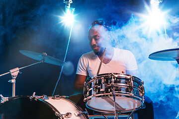 Image showing Young african-american jazz musician playing drums