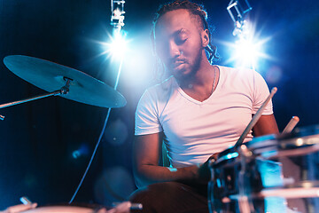 Image showing Young african-american jazz musician playing drums