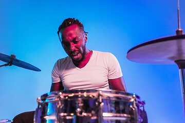 Image showing Young african-american jazz musician playing drums