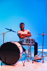 Image showing Young african-american jazz musician playing drums
