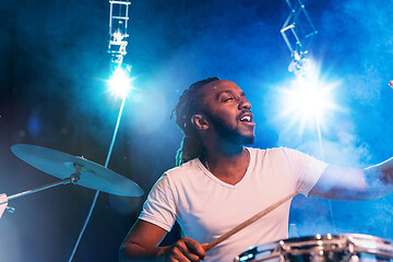 Image showing Young african-american jazz musician playing drums