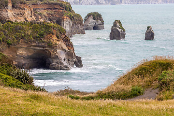 Image showing sea shore rocks and mount Taranaki, New Zealand