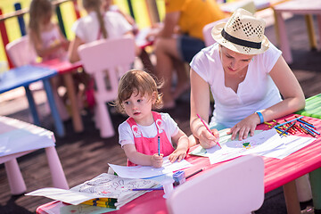 Image showing mom and little daughter drawing a colorful pictures