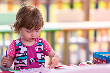 Image showing little girl drawing a colorful pictures