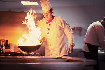 Image showing Chef doing flambe on food