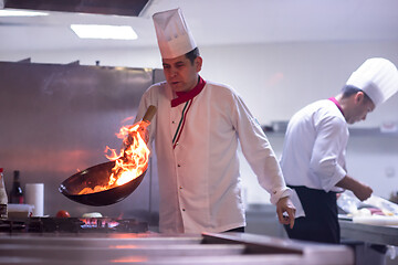 Image showing Chef doing flambe on food