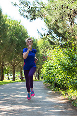 Image showing young female runner training for marathon