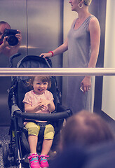 Image showing happy family in the elevator