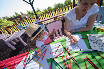 Image showing mom and little daughter drawing a colorful pictures