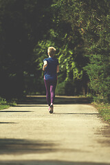 Image showing young female runner training for marathon