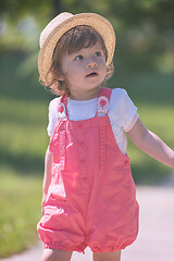 Image showing little girl runing in the summer Park