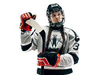 Image showing Young female hockey player with the stick isolated on white background