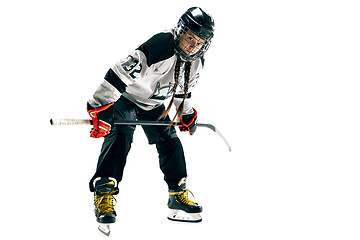 Image showing Young female hockey player with the stick isolated on white background