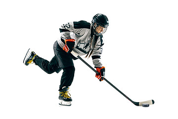 Image showing Young female hockey player with the stick isolated on white background