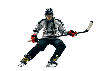 Image showing Young female hockey player with the stick isolated on white background