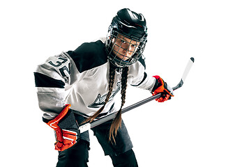 Image showing Young female hockey player with the stick isolated on white background