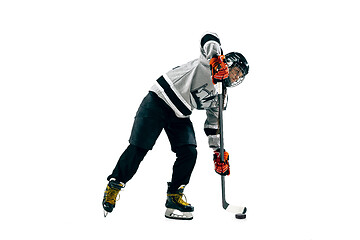 Image showing Young female hockey player with the stick isolated on white background