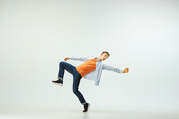 Image showing Man working at office and jumping isolated on studio background