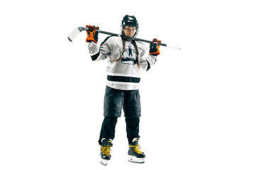 Image showing Young female hockey player with the stick isolated on white background