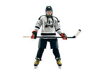 Image showing Young female hockey player with the stick isolated on white background
