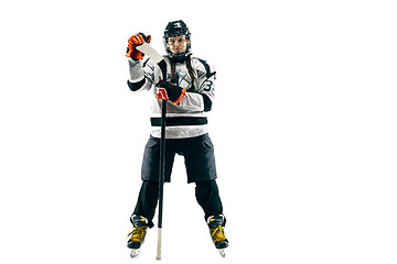 Image showing Young female hockey player with the stick isolated on white background