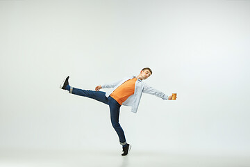 Image showing Man working at office and jumping isolated on studio background