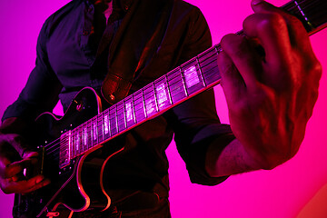 Image showing Young african-american jazz musician playing the guitar