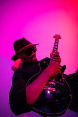 Image showing Young african-american jazz musician playing the guitar