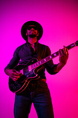 Image showing Young african-american jazz musician playing the guitar