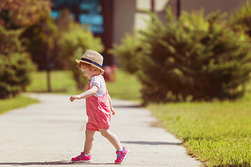 Image showing little girl runing in the summer Park