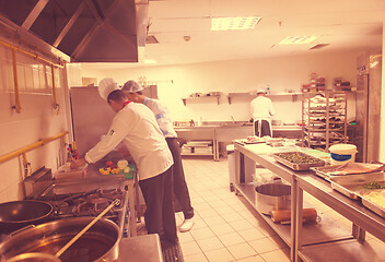 Image showing team cooks and chefs preparing meals