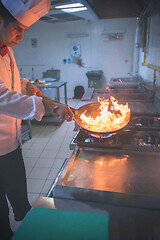 Image showing Chef doing flambe on food