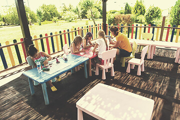 Image showing mom and little daughter drawing a colorful pictures