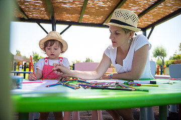 Image showing mom and little daughter drawing a colorful pictures