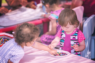 Image showing little girl drawing a colorful pictures