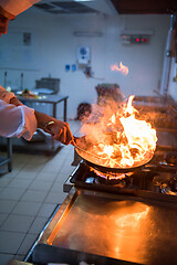 Image showing Chef doing flambe on food