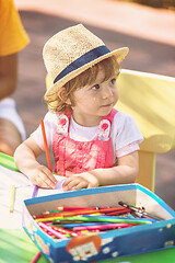 Image showing little girl drawing a colorful pictures