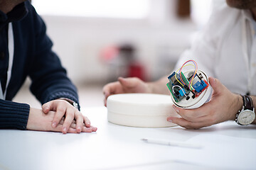 Image showing engineers working and discussing about project