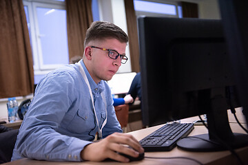 Image showing businessman working using a computer in startup office