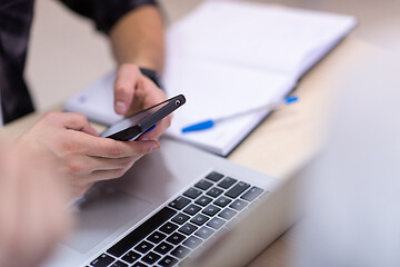 Image showing business people hands using smart phone