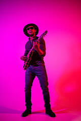 Image showing Young african-american jazz musician playing the guitar