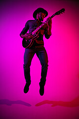 Image showing Young african-american jazz musician playing the guitar