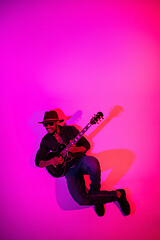 Image showing Young african-american jazz musician playing the guitar