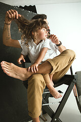 Image showing Father playing with young son in their sitting room