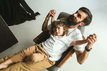 Image showing Father playing with young son in their sitting room