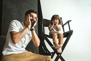 Image showing Father playing with young son in their sitting room