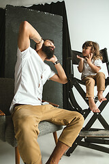 Image showing Father playing with young son in their sitting room